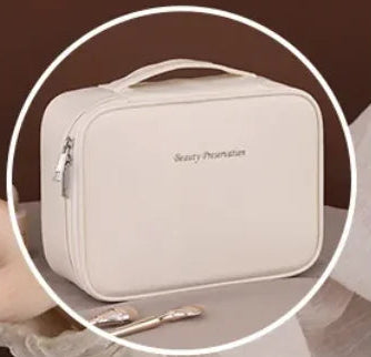 Beige cosmetic bag with makeup items on a brown background