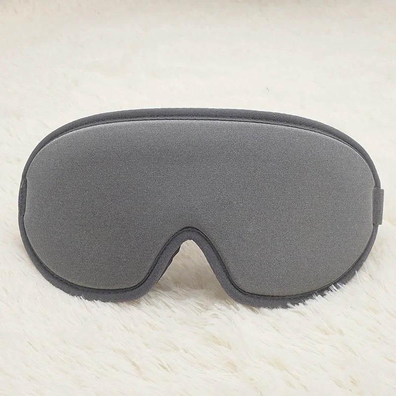 Grey memory foam eye mask for sleep and travel
