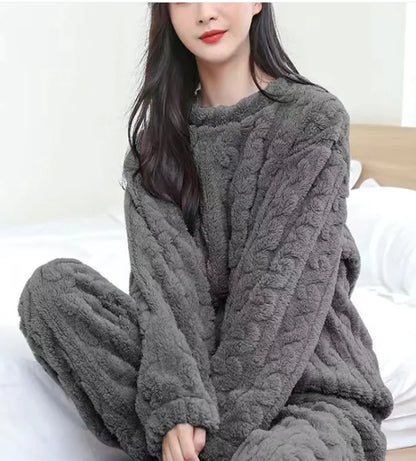 Person wearing a gray cable knit loungewear set on a white background