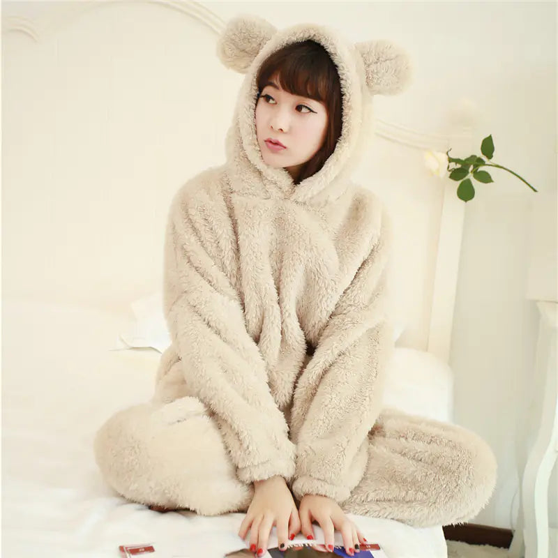 Woman wearing beige coral fleece pyjama set – warm winter loungewear