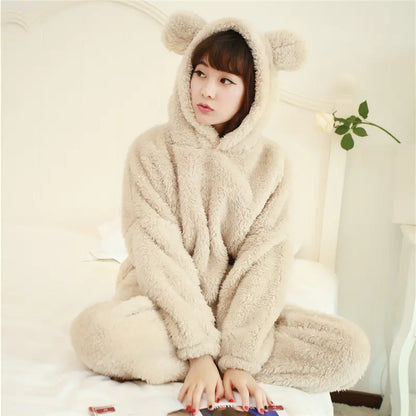 Woman wearing beige coral fleece pyjama set – warm winter loungewear