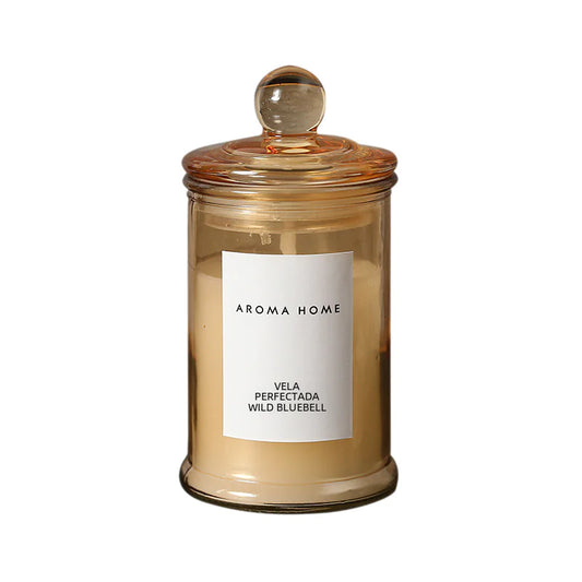 Aroma Home candle in a glass jar with a white label on a white background