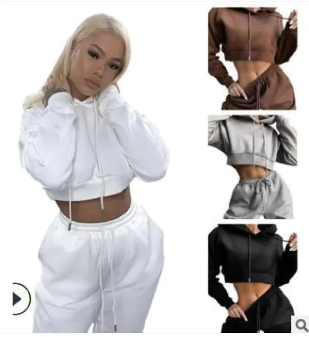 White hoodie and pants set with additional color options displayed.